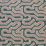 Detail of fabric in a dense meandering print in white, pink and red on a navy field.