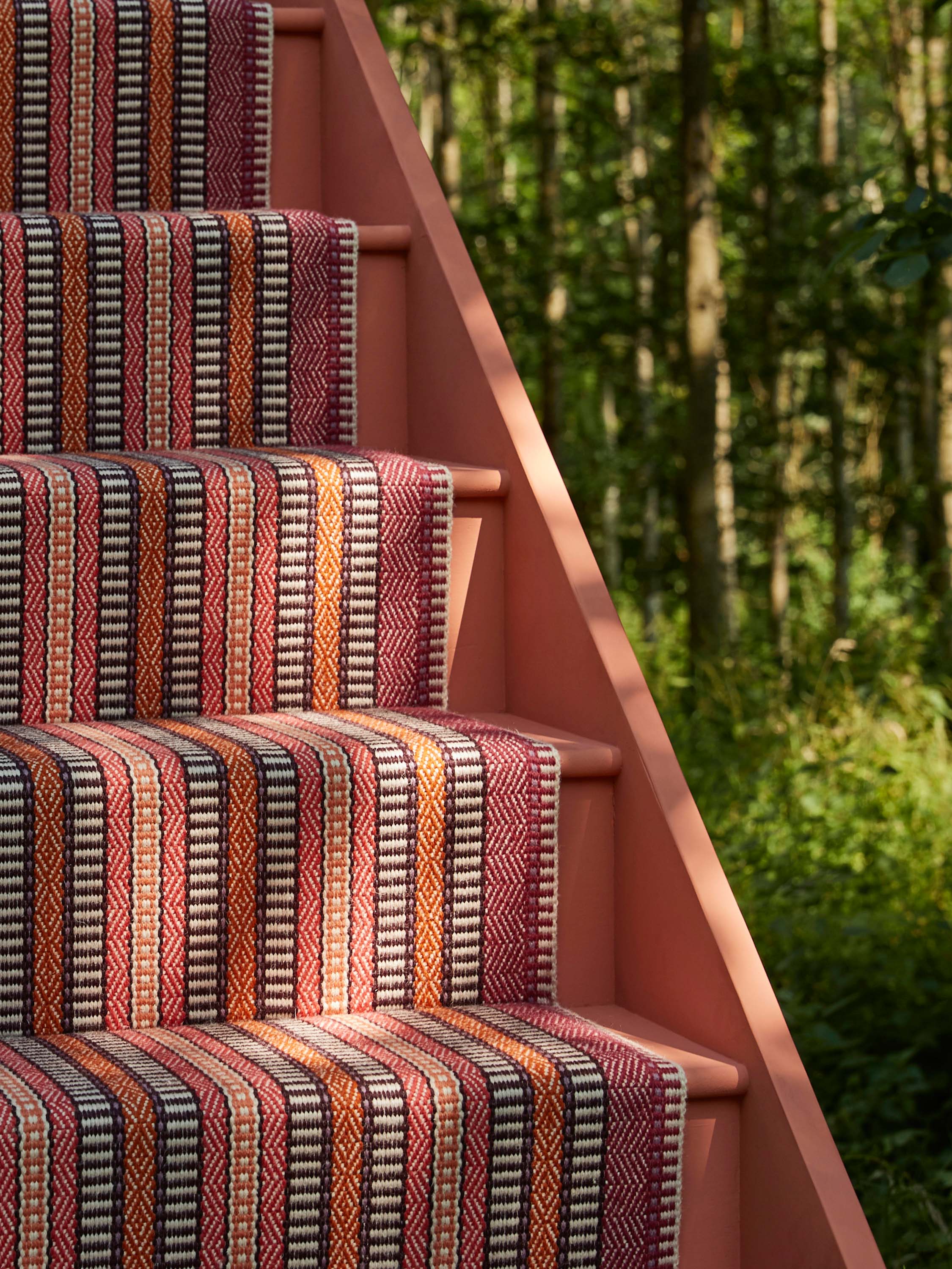 Striped flatweave runner in orange black red