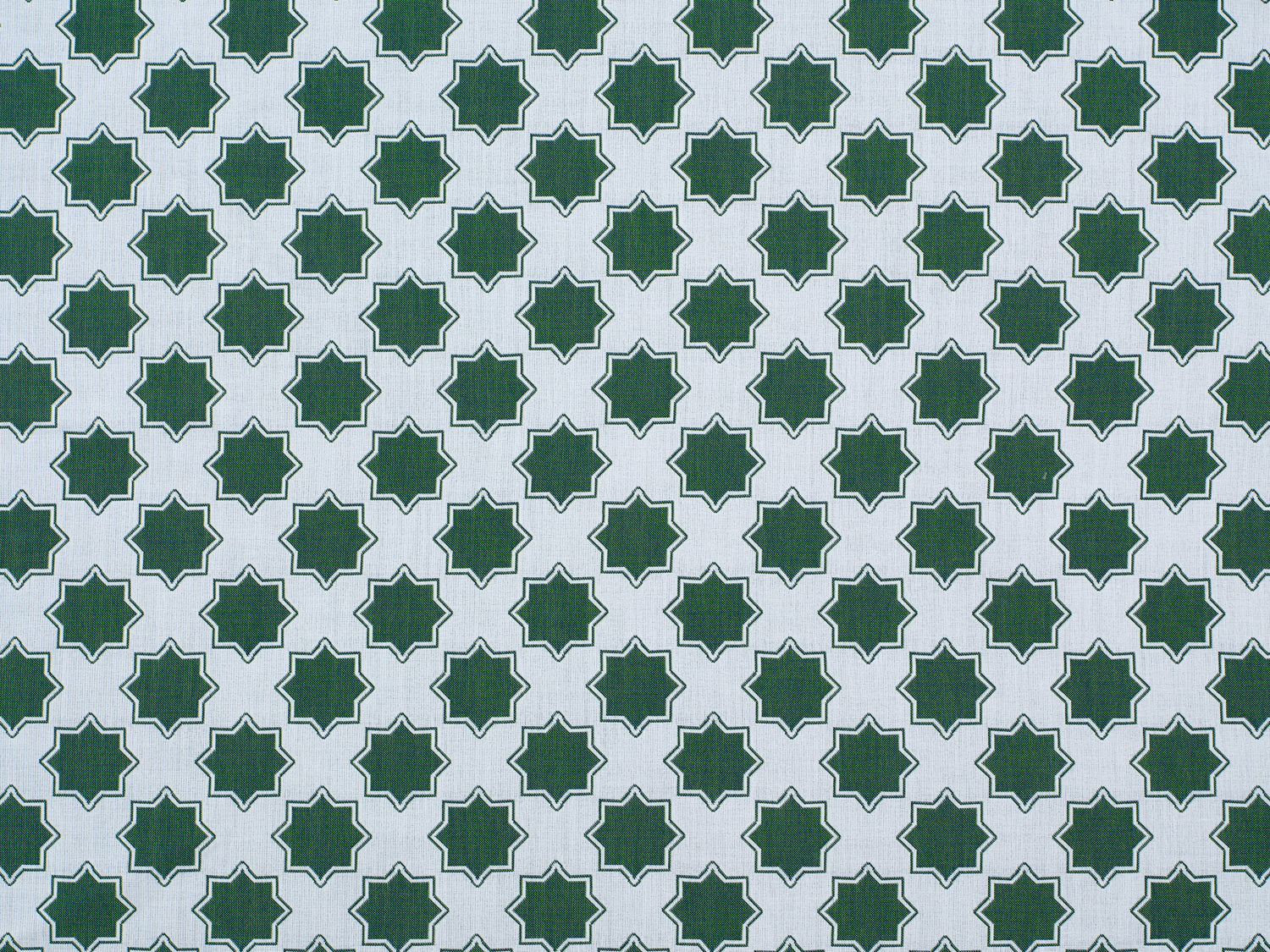 Moroccan star performance fabric in green on white. 
