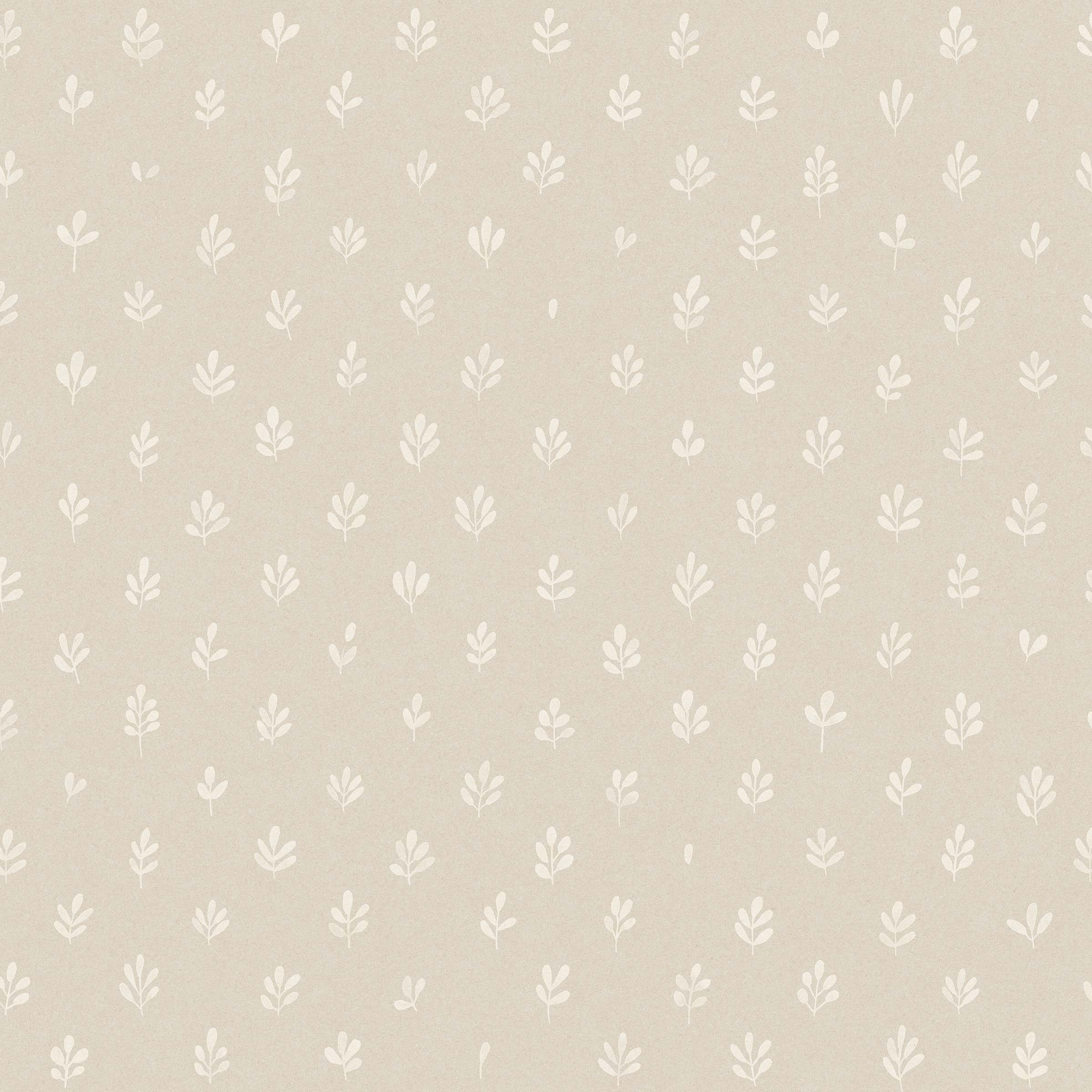 Detail of wallpaper in a repeating leaf print in white on a cream field.