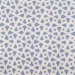 Detail of fabric in a geometric lattice print in blue on a cream field.