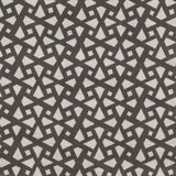 Detail of fabric in a geometric lattice print in charcoal on a greige field.