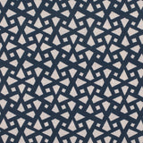 Detail of fabric in a geometric lattice print in navy on a cream field.