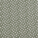 Detail of fabric in a geometric lattice print in sage on a greige field.