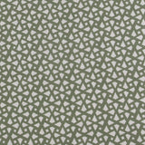 Detail of fabric in a geometric lattice print in sage on a greige field.