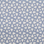 Detail of fabric in a geometric lattice print in blue on a cream field.