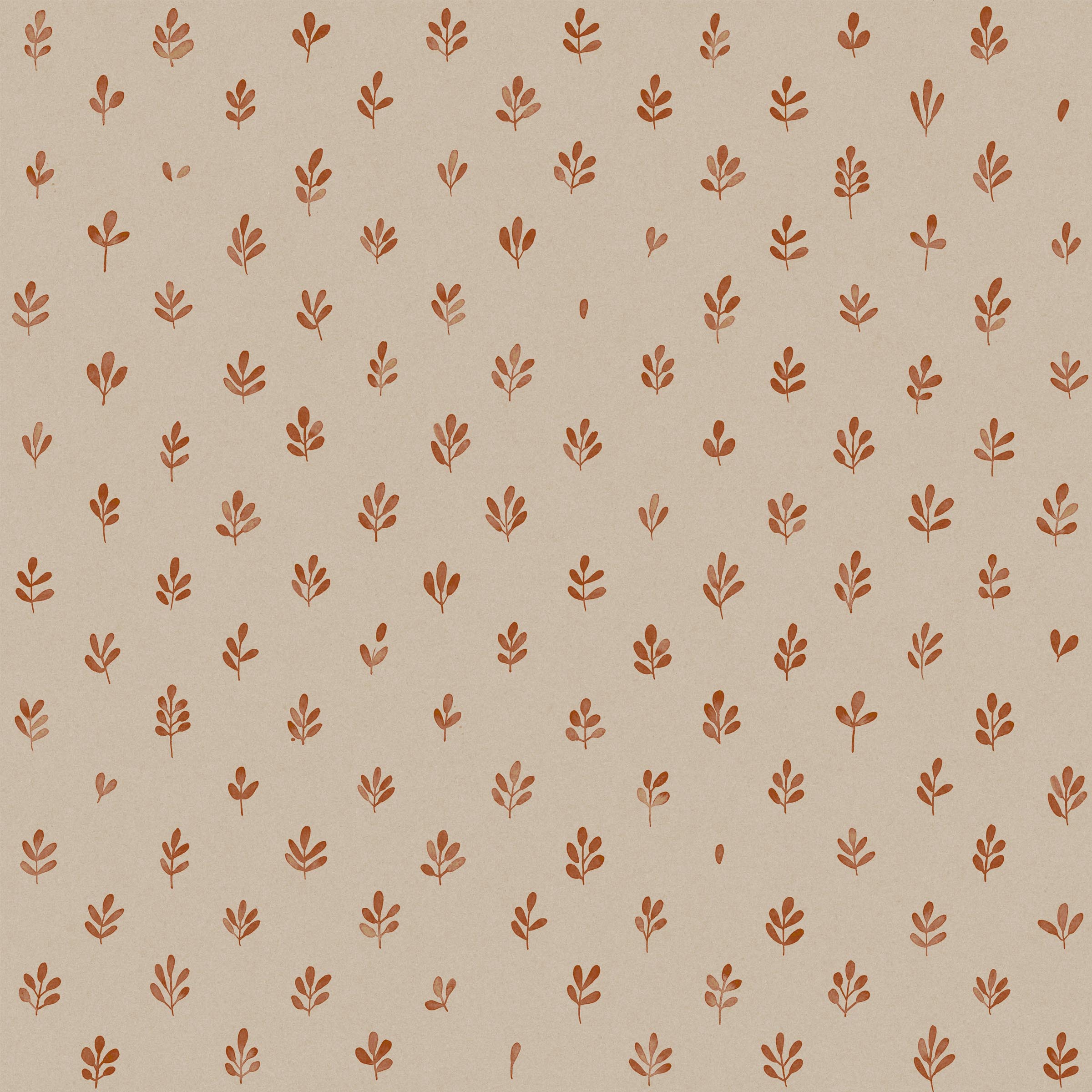 Detail of fabric in a repeating leaf print in burnt orange on a cream field.