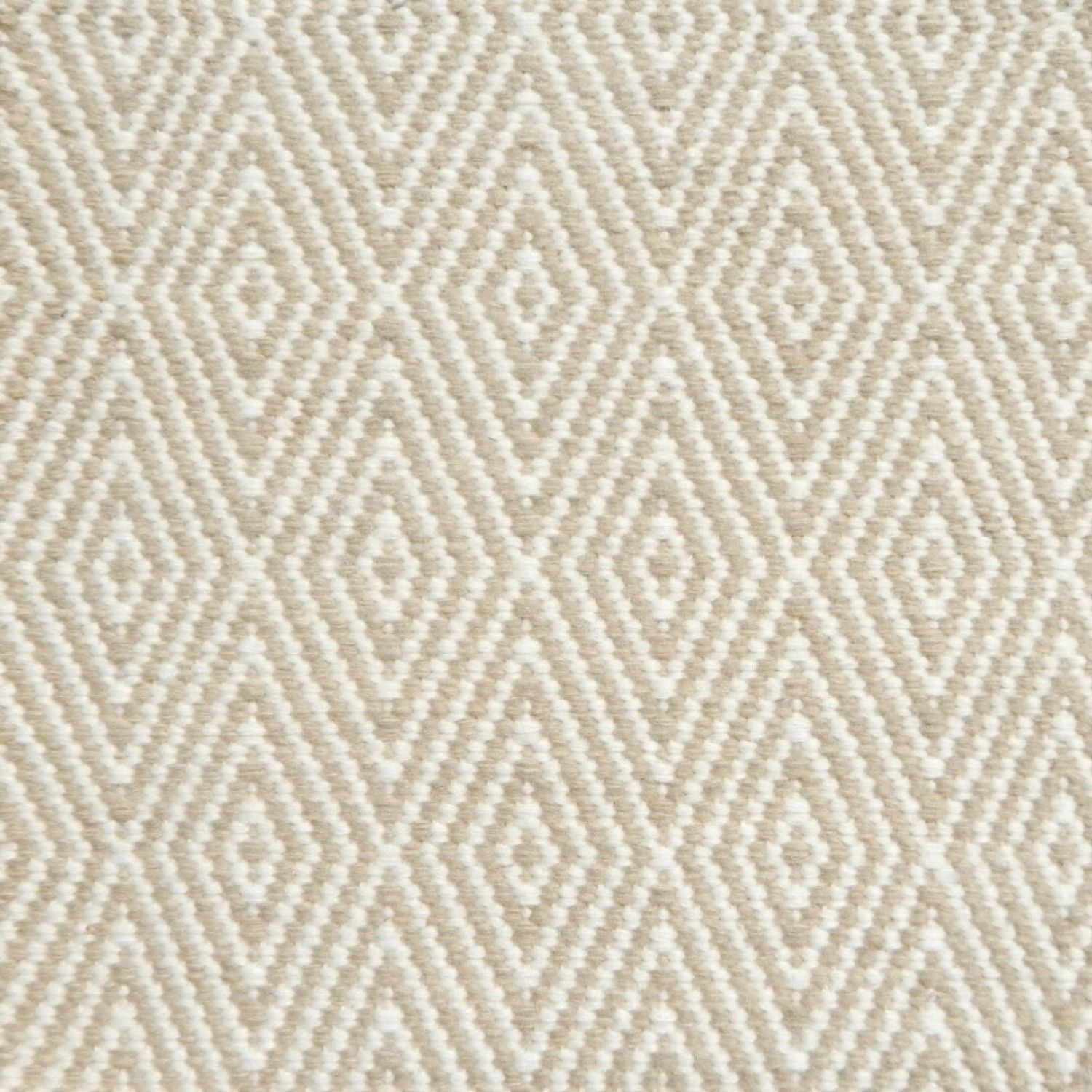Flatwoven rug detail with a cream and taupe diamond pattern.