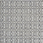 A rug with an overall geometric pattern in dark blue grey and ivory.