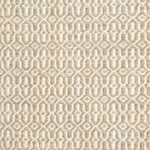 A rug with a woven overall pattern in tan and ivory.