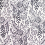 Detail of fabric in a dense floral print in black and white on a white field.