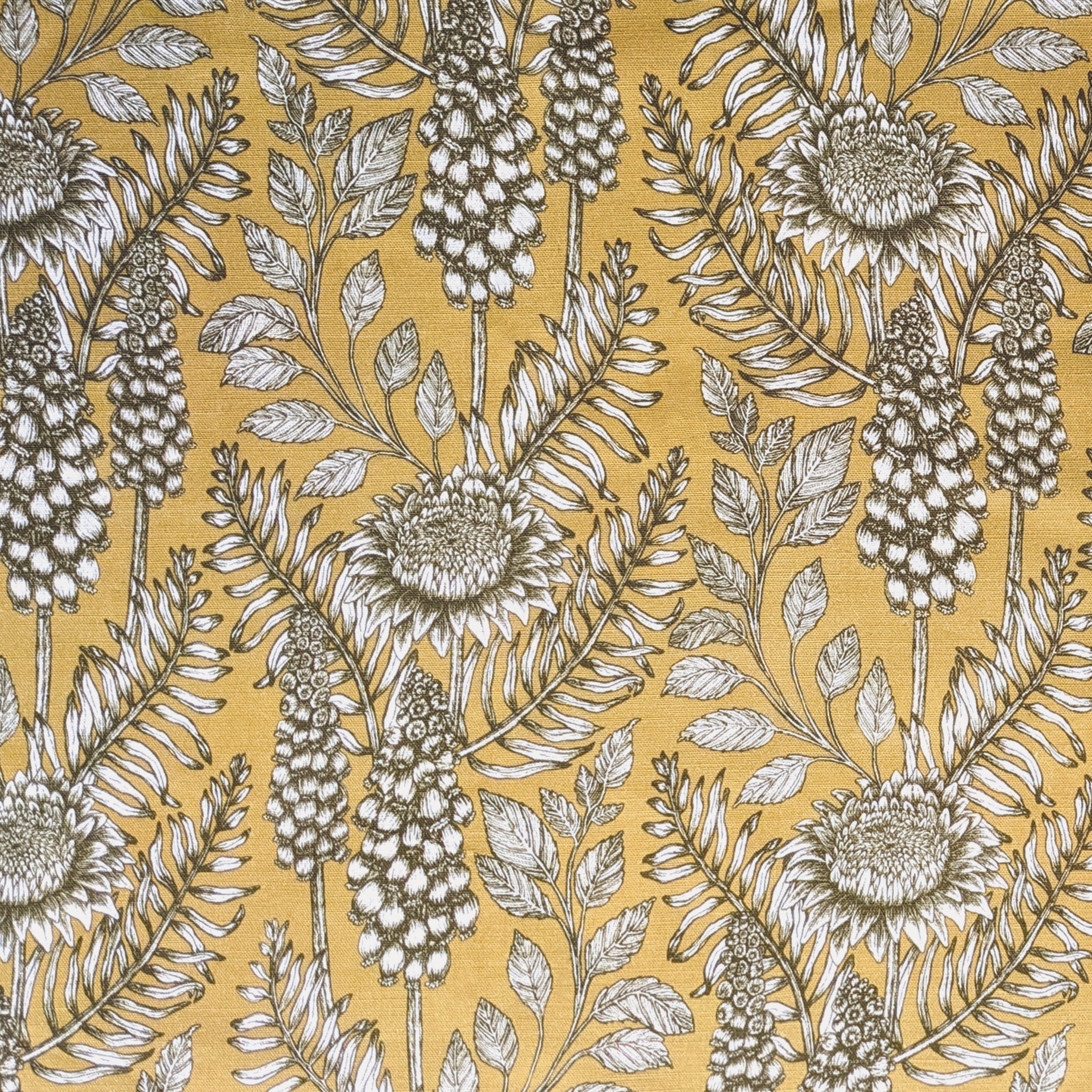 Detail of fabric in a dense floral print in black and white on a yellow field.