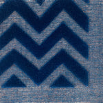 Close-up of blue carpet with zigzag pattern