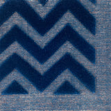 Close-up of blue carpet with zigzag pattern