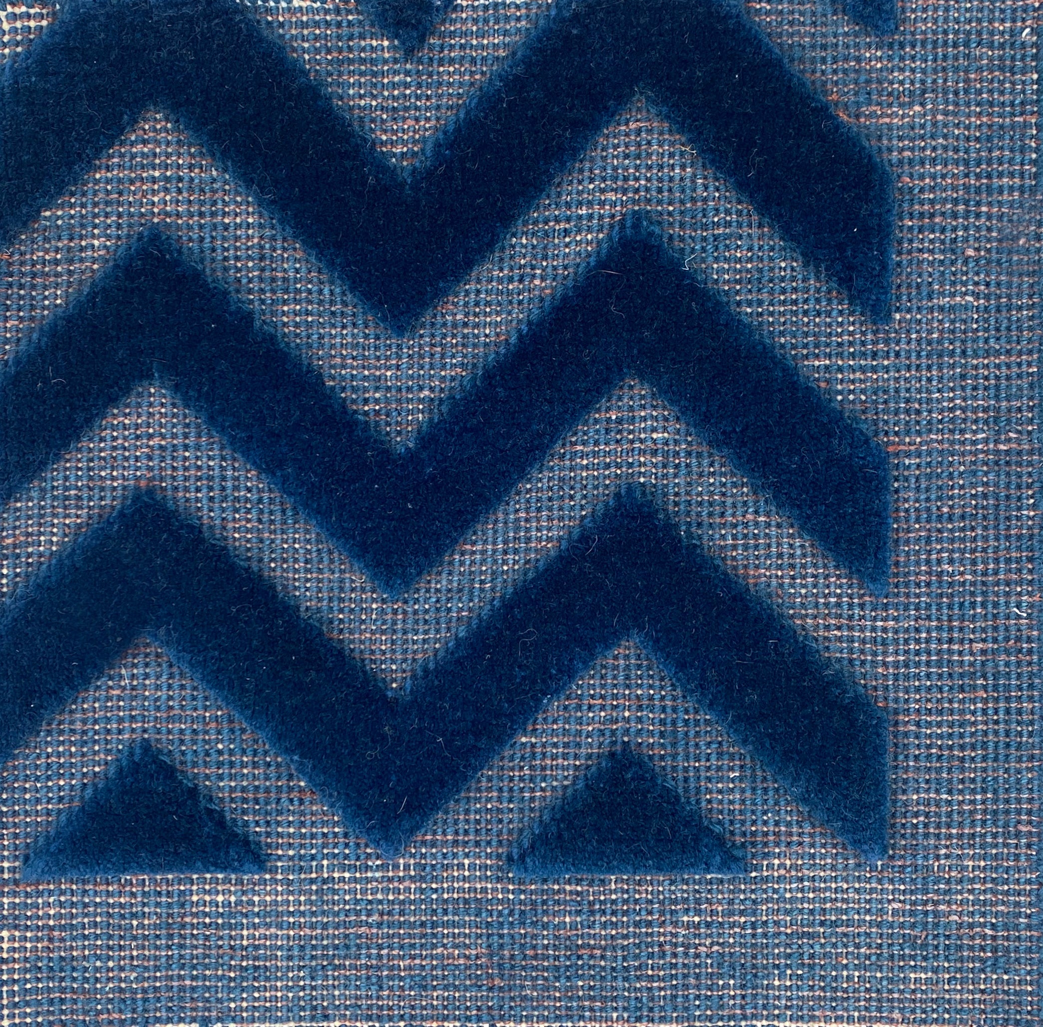 Close-up of blue carpet with zigzag pattern