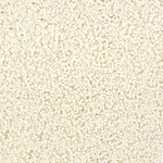 A close-up texture shot of a handtufted rug, showing the looped pile texture in a solid cream color.