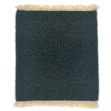 Dark gray rug with beige fringes on a white background