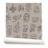 Partially unrolled wallpaper with black hand-drawn illustrations of New York City landmarks on a tan background.