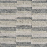 Flatweave rug in a broken stripe in grey, cream and taupe. 