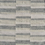 Flatweave rug in a broken stripe in grey, cream and taupe. 