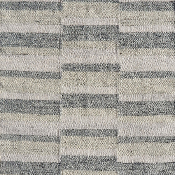 Flatweave rug in a broken stripe in grey, cream and taupe. 
