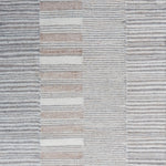 Flatweave rug in a broken stripe in grey, cream and taupe. 