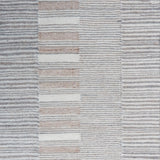Flatweave rug in a broken stripe in grey, cream and taupe. 