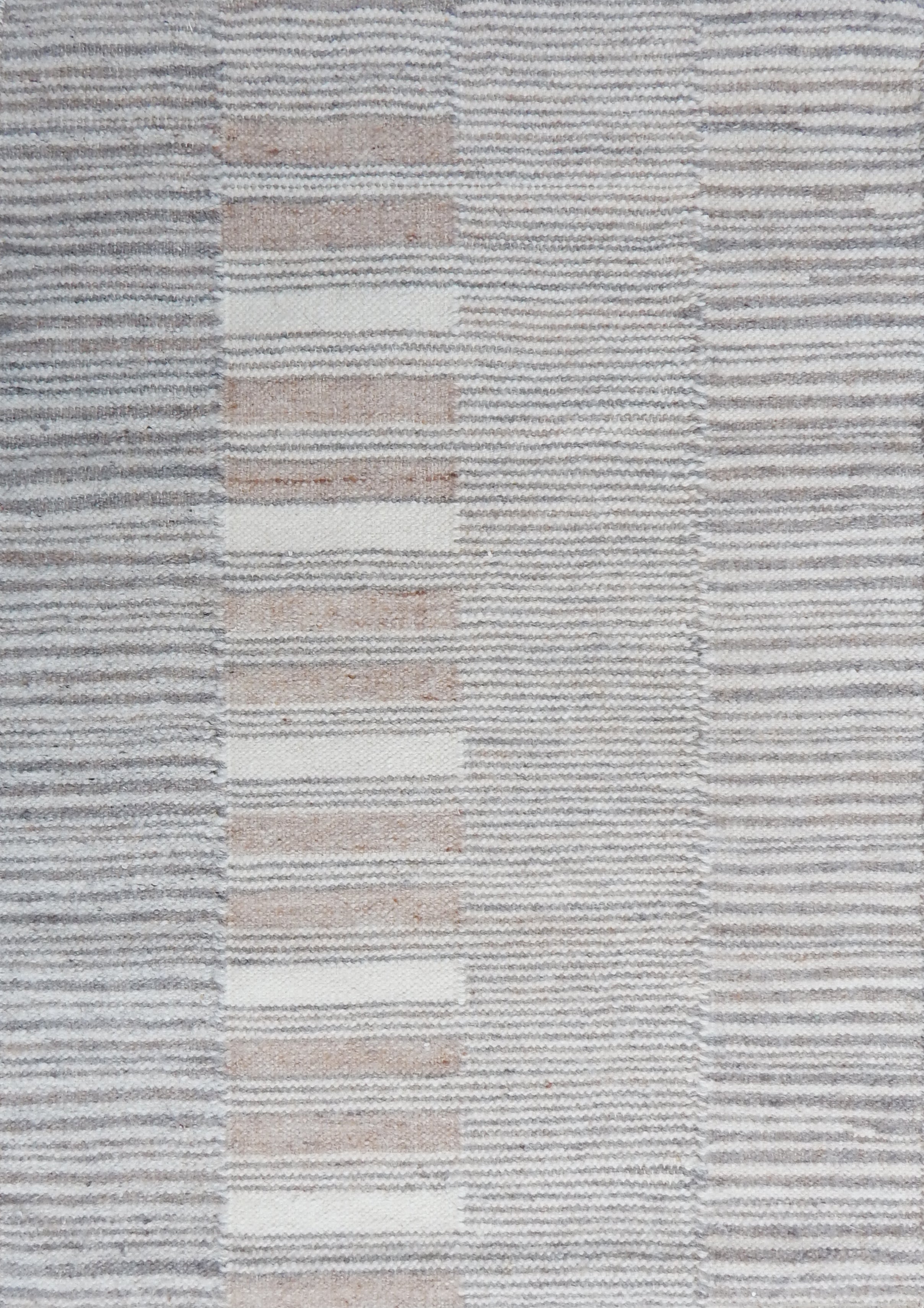 Flatweave rug in a broken stripe in grey, cream and taupe. 