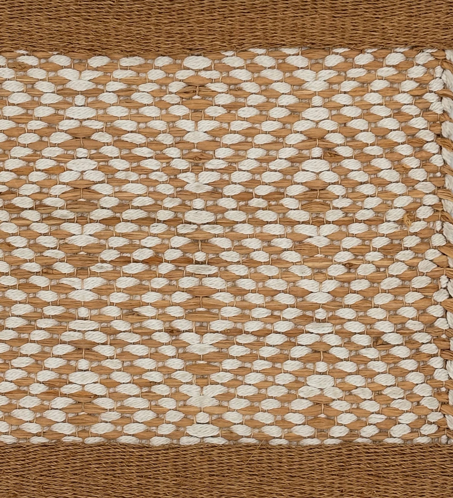 Handwoven rug sample in with cotton and raffia.