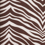 Detail of fabric in a zebra print in brown on a white field.