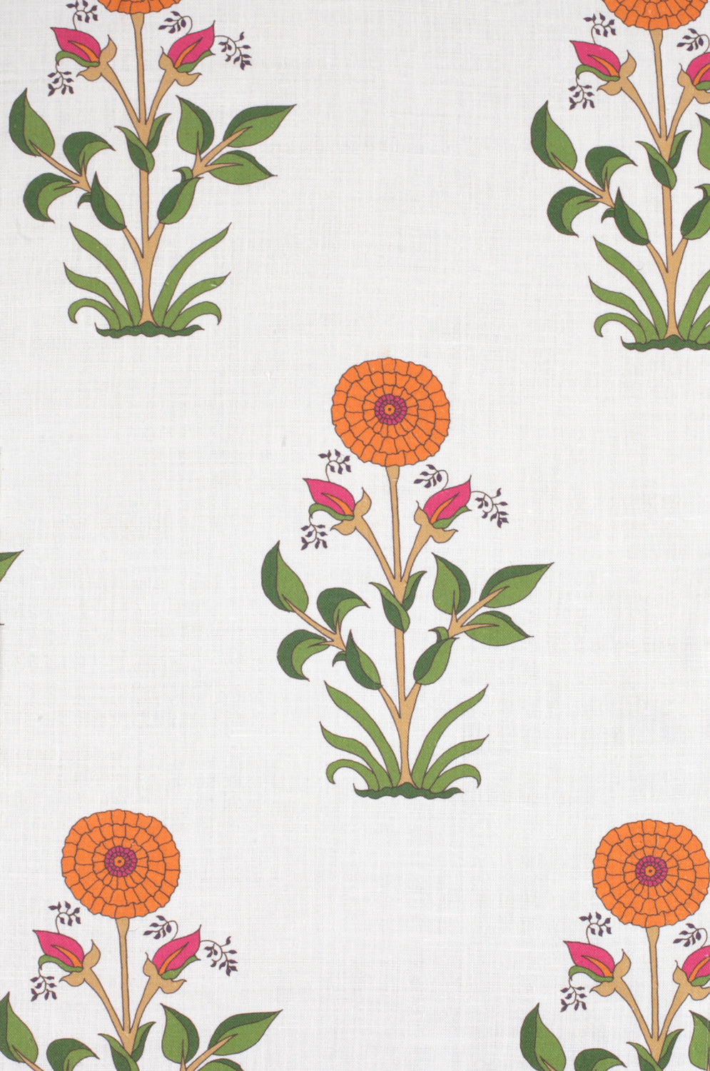 Detail of fabric in a large-scale marigold print in orange, pink and green on a white field.