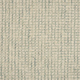 Broadloom carpet in a textural checkered pattern in ivory and light green. 