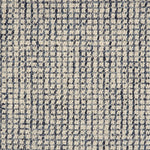 Broadloom carpet in a textural checkered pattern in ivory and blue.
