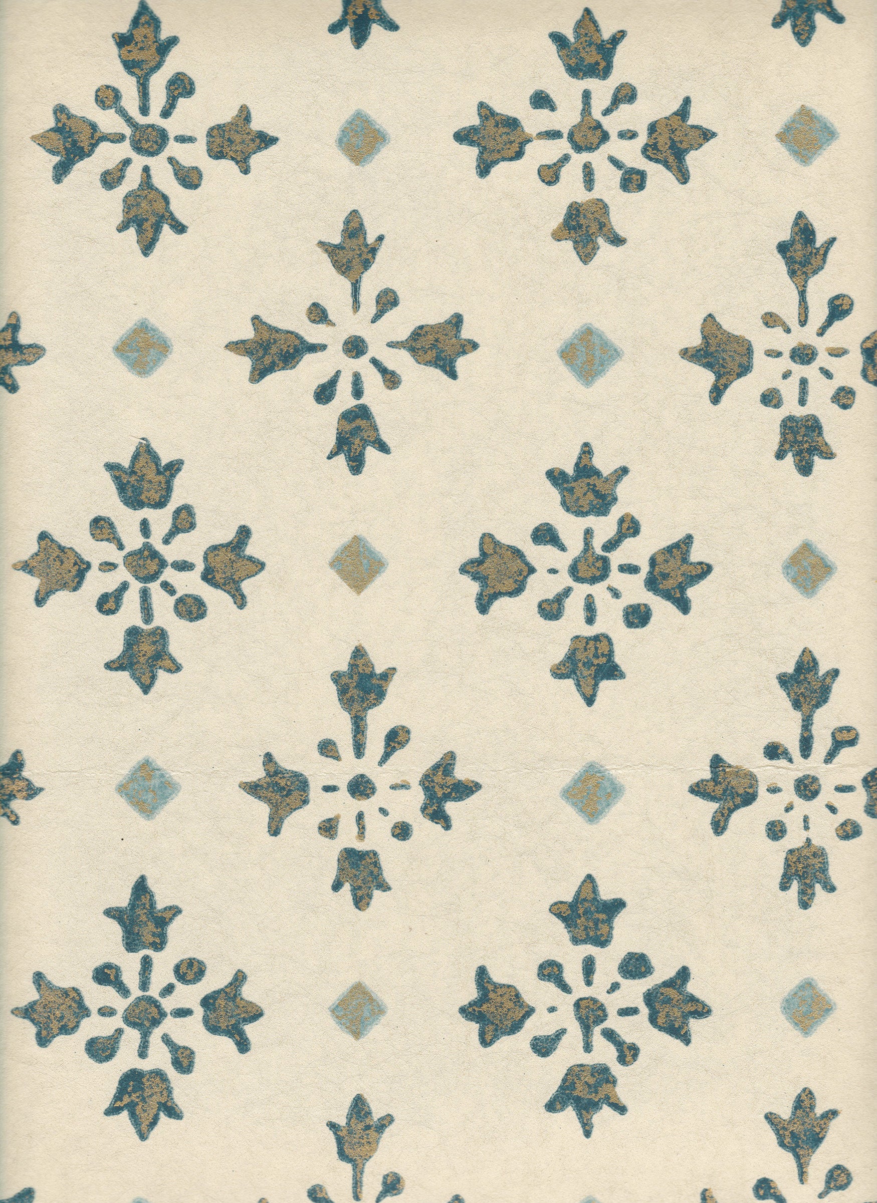 Detail of wallpaper in a botanical grid print in navy, blue and metallic gold on a white field.