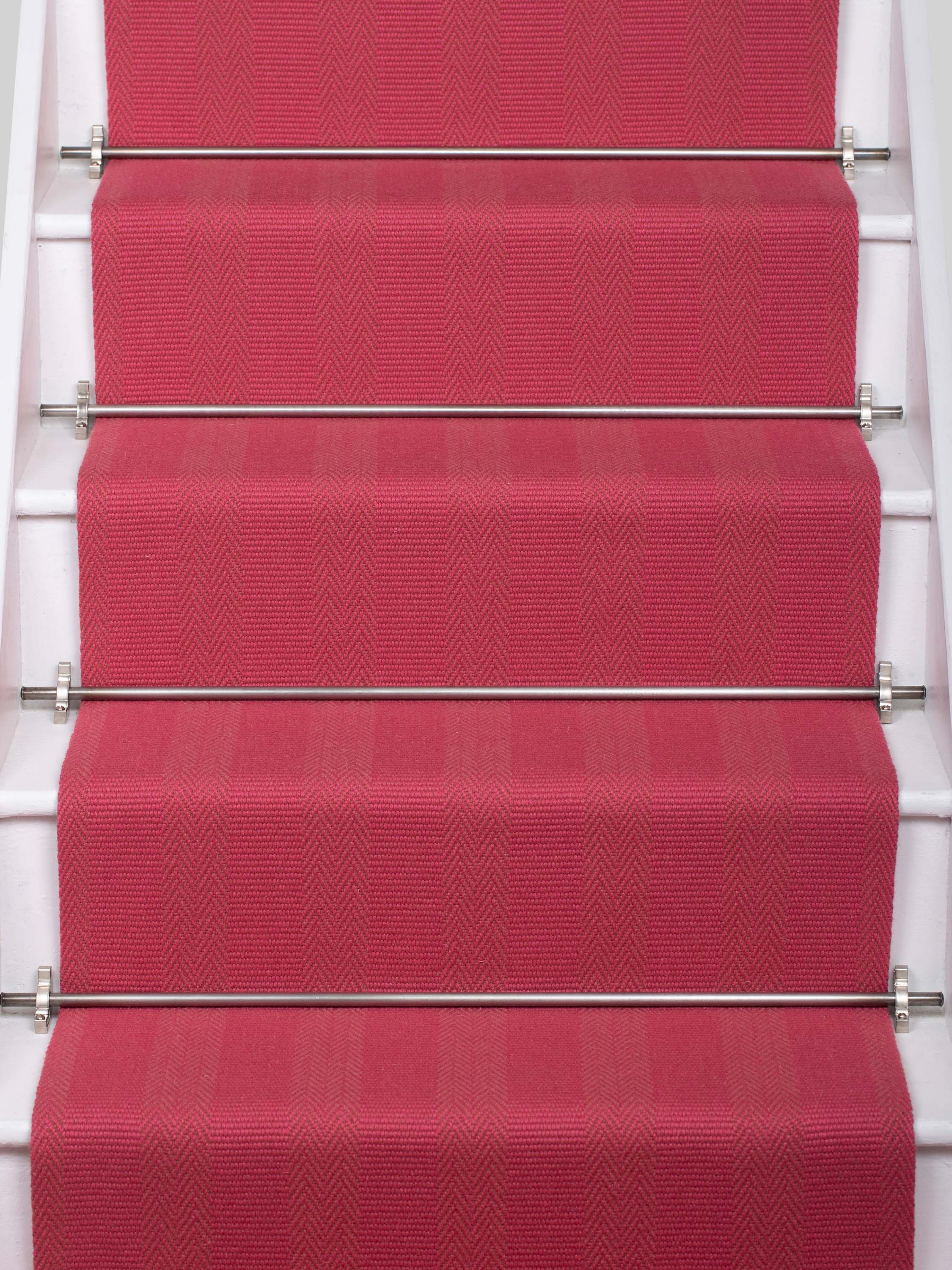 Striped flatweave runner in pink on white staircase