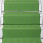 Striped flatweave runner in green on white staircase