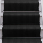 Striped flatweave runner in black on white staircase