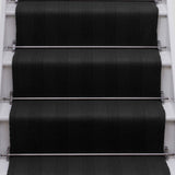 Striped flatweave runner in black on white staircase