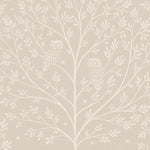 Detail of wallpaper in a repeating owl and tree print in white on a cream field.