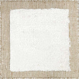 Handloomed rug with neutral border and raised cut pile shag field in white.