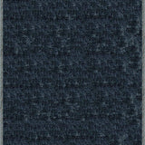 Handloomed rug with neutral border and raised cut pile shag field in midnight blue.