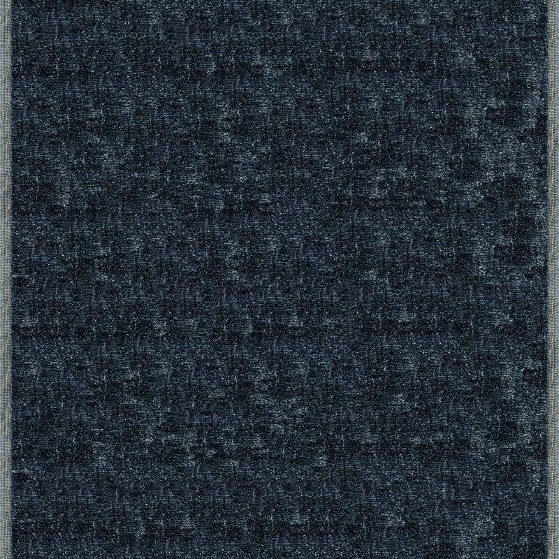 Handloomed rug with neutral border and raised cut pile shag field in midnight blue.