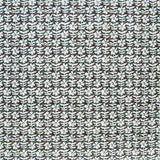 Detail of fabric in a floral grid print in white on a dark brown field.
