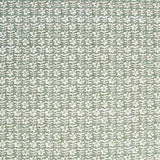 Detail of fabric in a floral grid print in white and sage on a light green field.