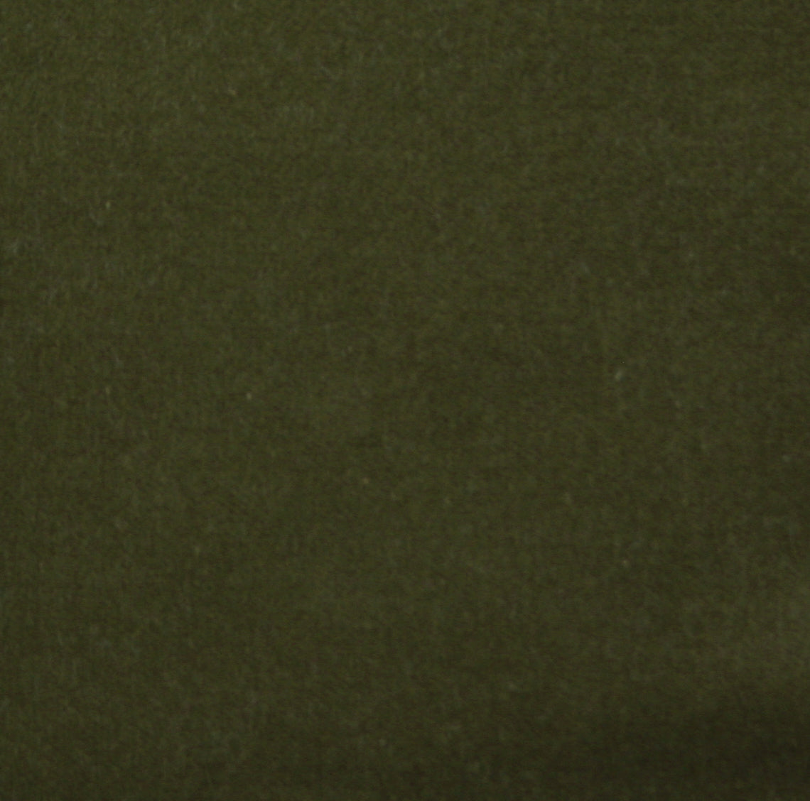 Detail of velvet fabric yardage in olive.