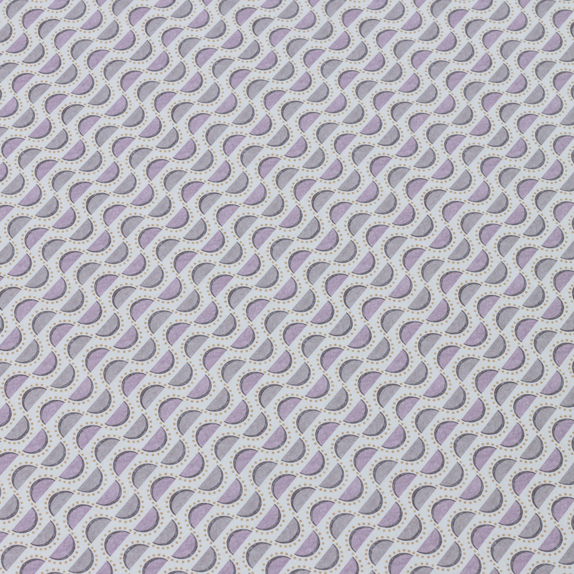 Detail of a wallpaper panel in a linear geometric print in shades of purple and navy on a light blue field.