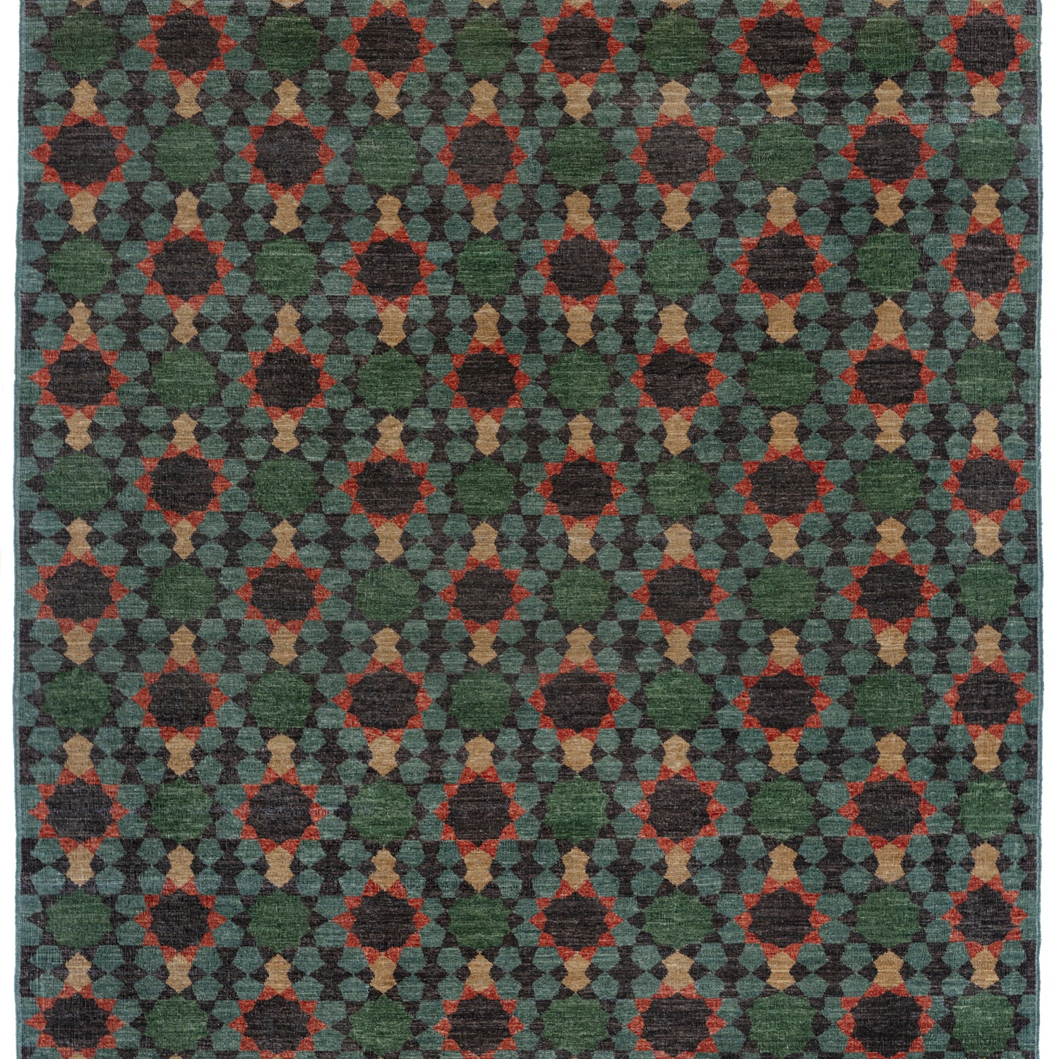 Handknotted rug in a sunburst mosaic style pattern in teal, green, red and tan. 