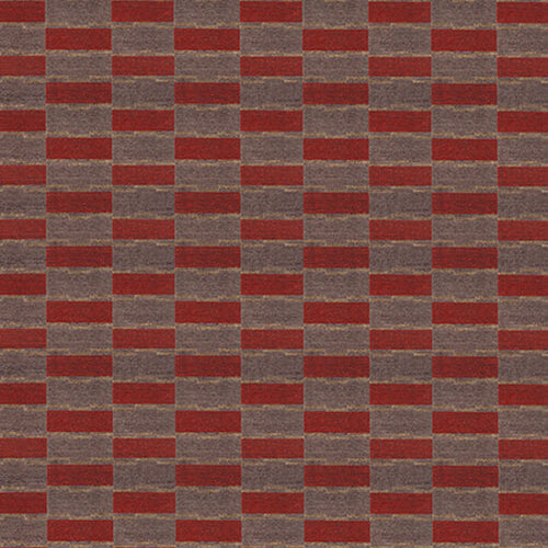 Handwoven carpet in a geometric design in brown, red with yellow accent. 