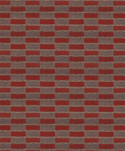 Handwoven carpet in a geometric design in brown, red with yellow accent. 