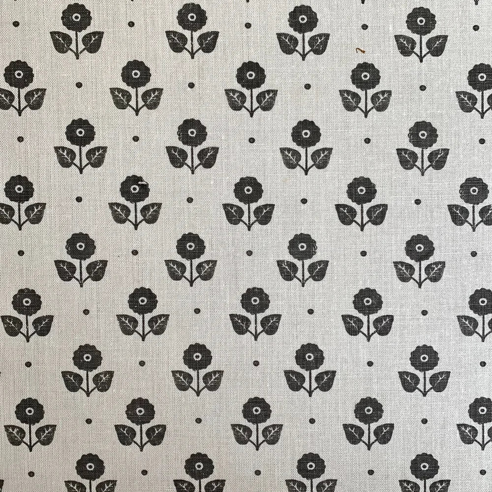 Black floral pattern on a light gray background